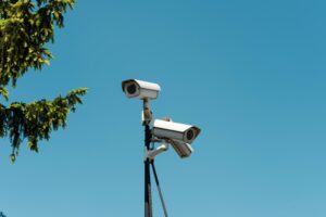 Outdoor CCTV security cameras mounted on a pole for 24/7 surveillance, home security, business security, and property monitoring under a clear blue sky in Kenya