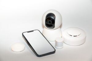 Smart home security system with CCTV camera, motion sensor, smoke detector and smartphone